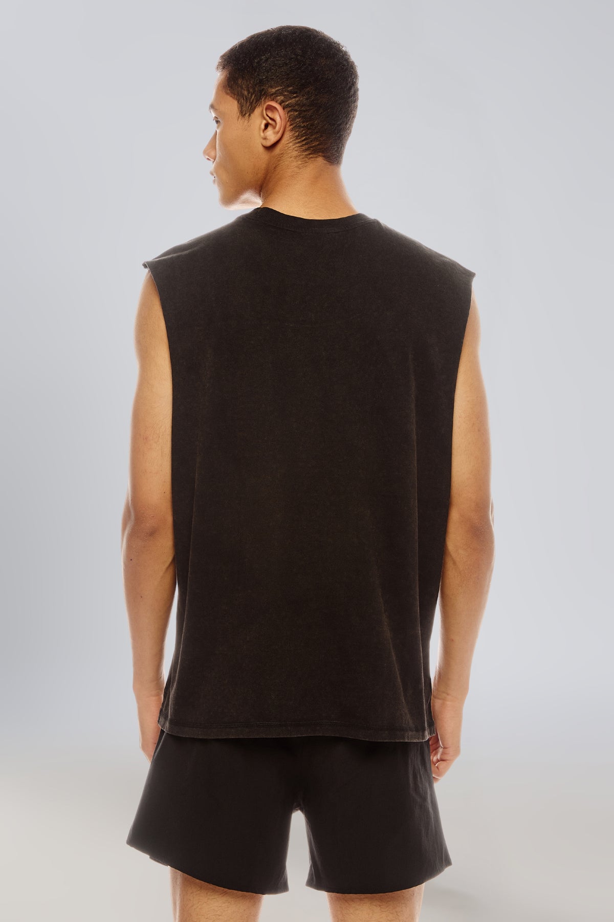 Back view of the black carbon wash tank top showing the sleeveless cut