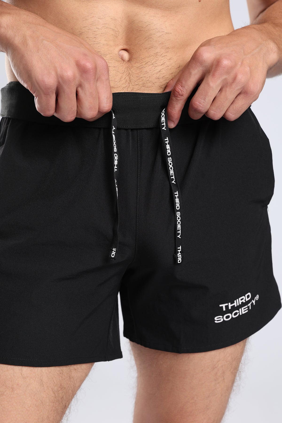 Close-up of the elastic waistband on black Hybrid 5-Inch Running Shorts