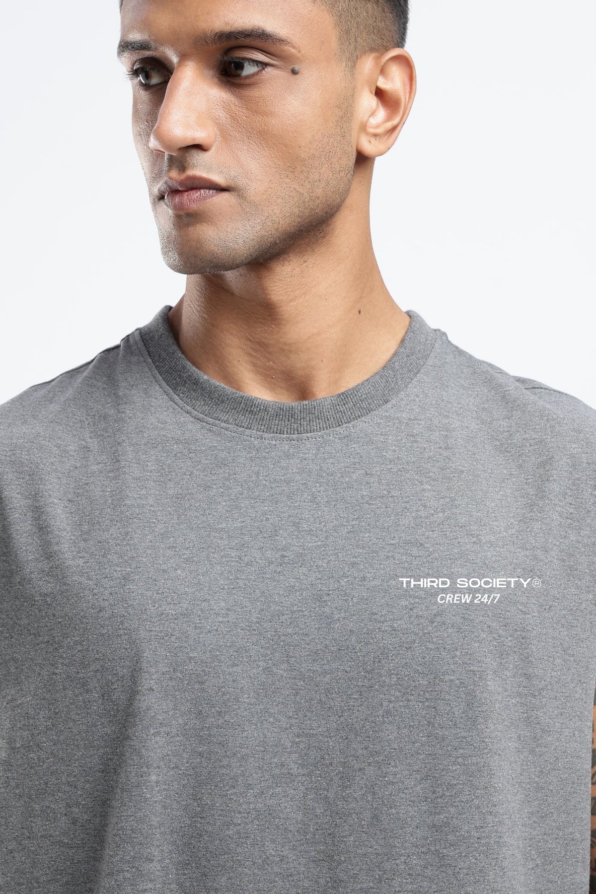 Close-up of the Grey Marl tank top showing the Third Society Crew 24/7 chest branding