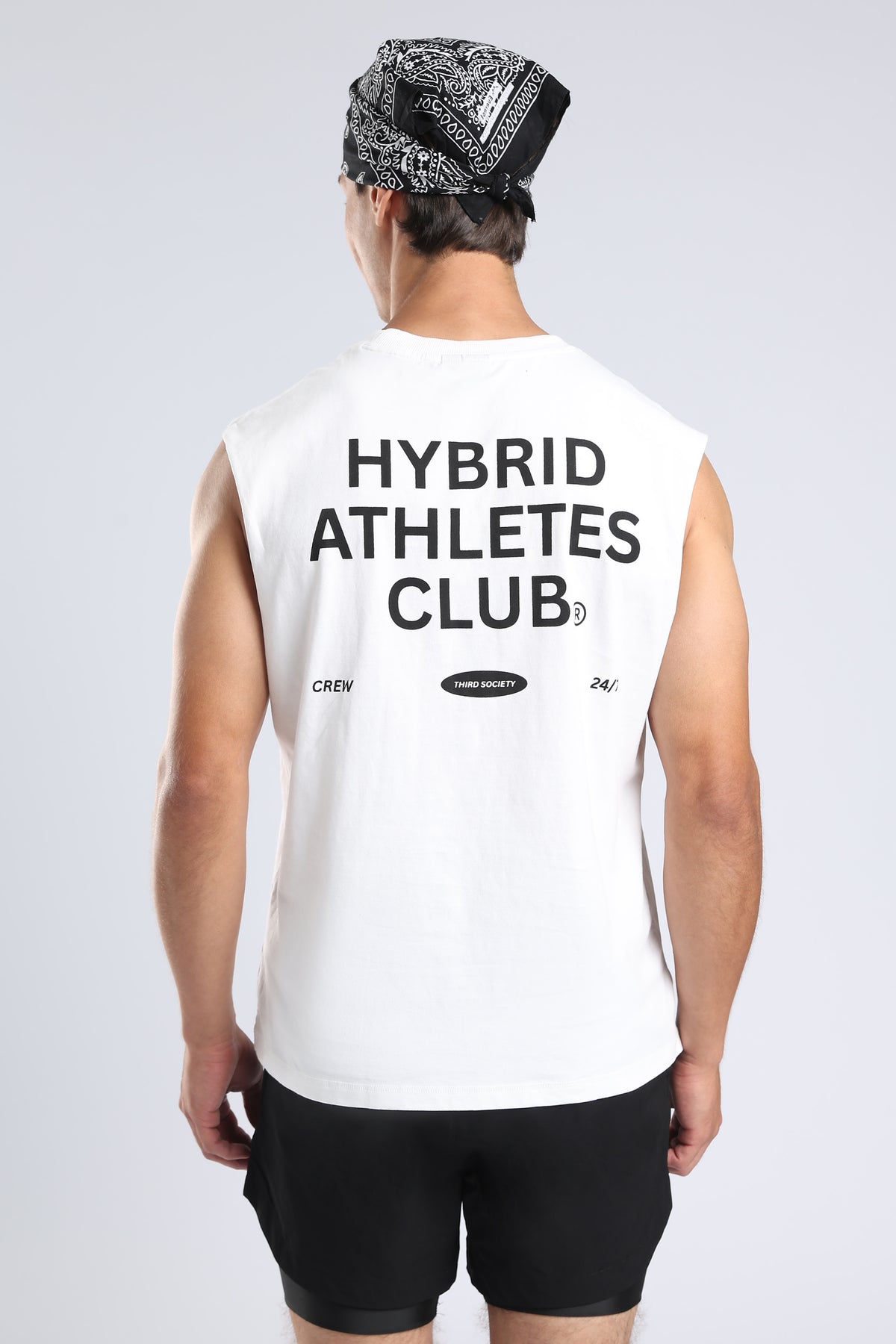 Close-up of the black Hybrid Athletes Club graphic on the white tank
