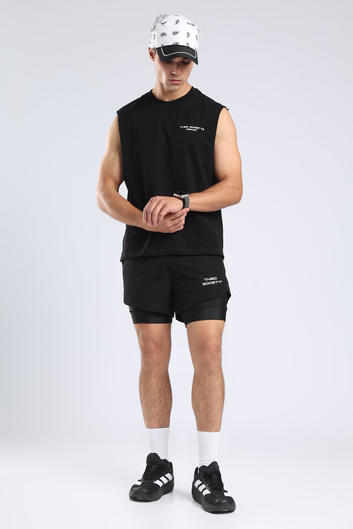 Model wearing the black Lifting Community tank with black training shorts