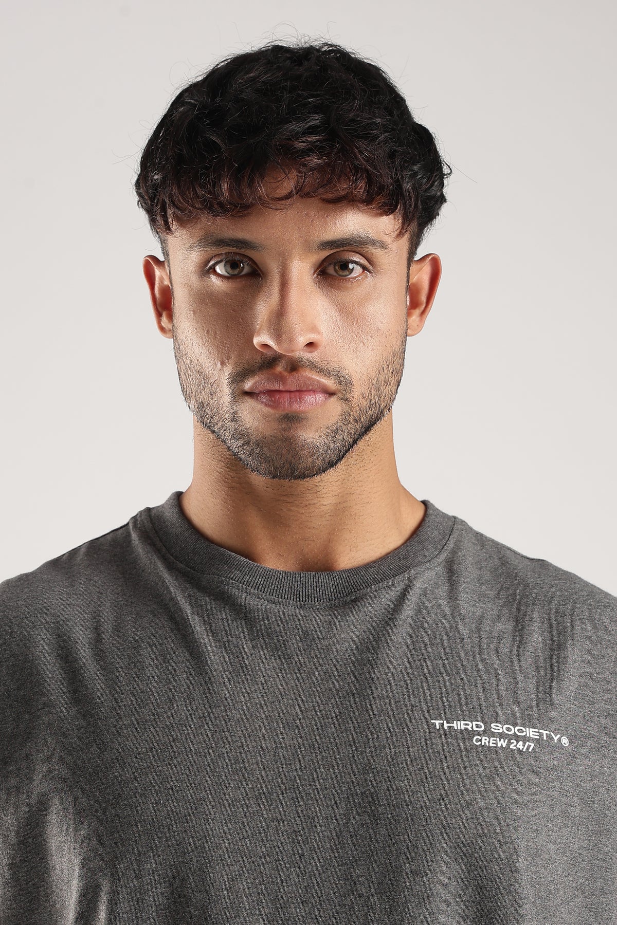 Close-up of the Grey Marl Obsessed Tank showing the Third Society Crew 24/7 chest logo