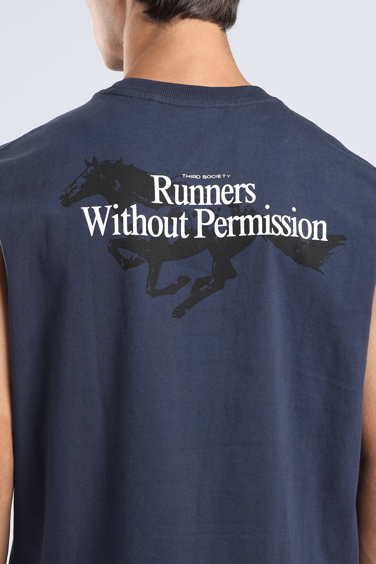 Close-up of the running horse and Runners Without Permission graphic on the Iron Blue tank