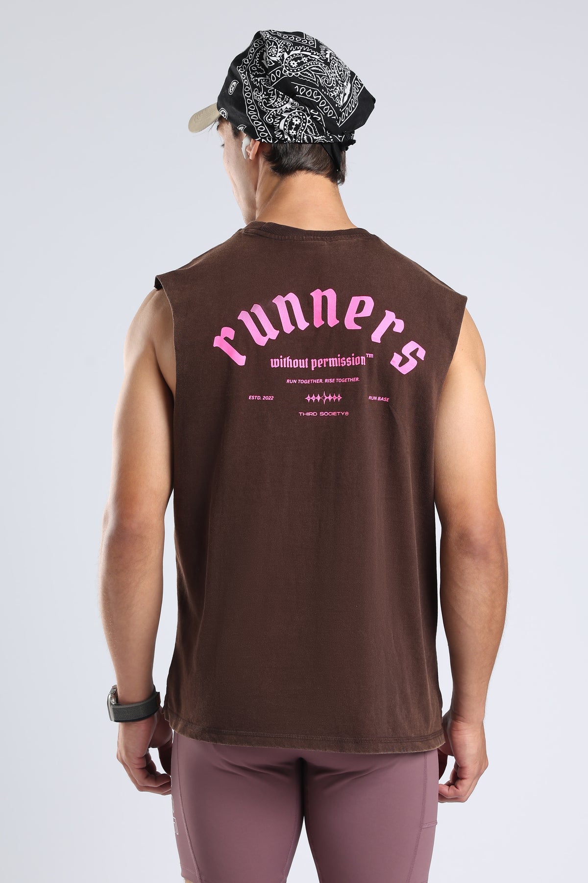 Close-up of the pink Runners Without Permission graphic on the Brown tank