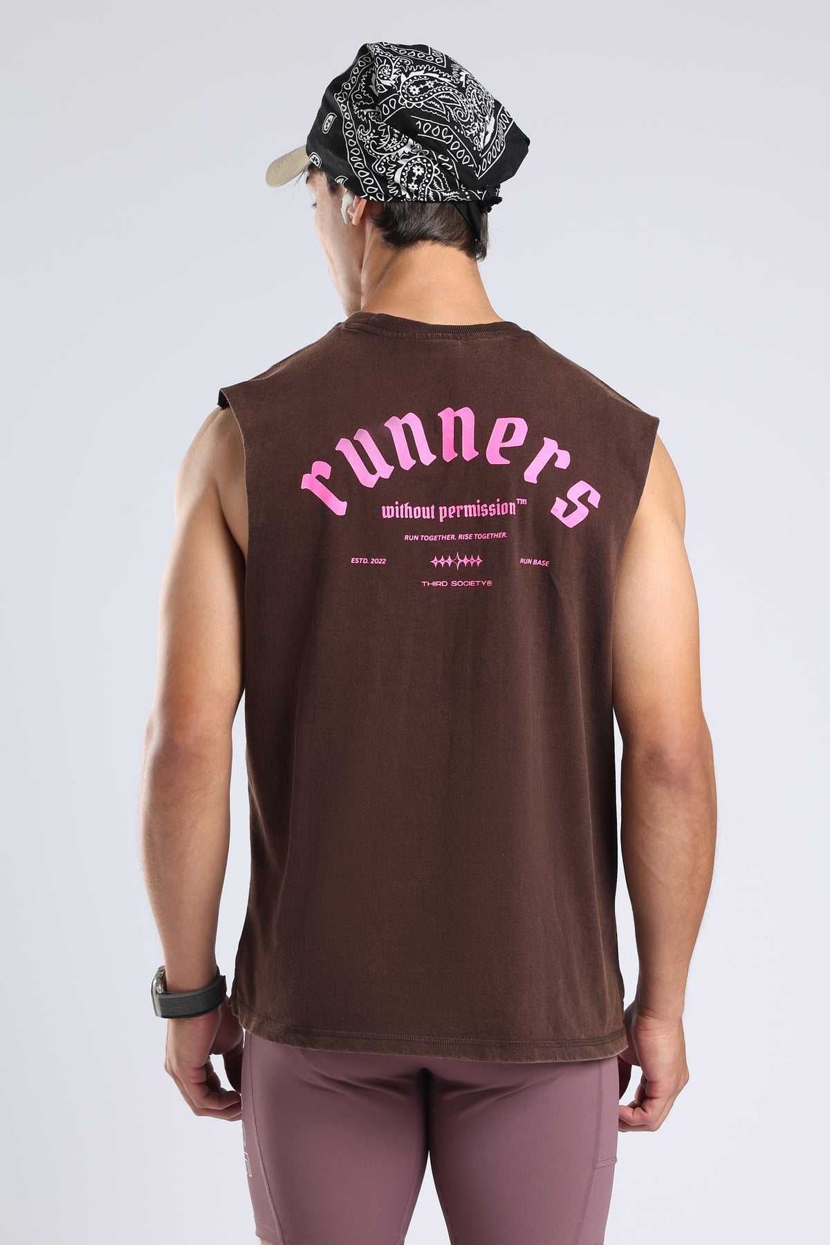 Close-up of the pink Runners Without Permission graphic on the Brown tank