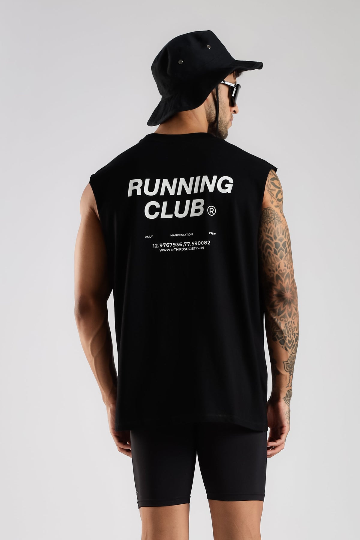 Running Club black tank top showing the oversized fit and back graphic