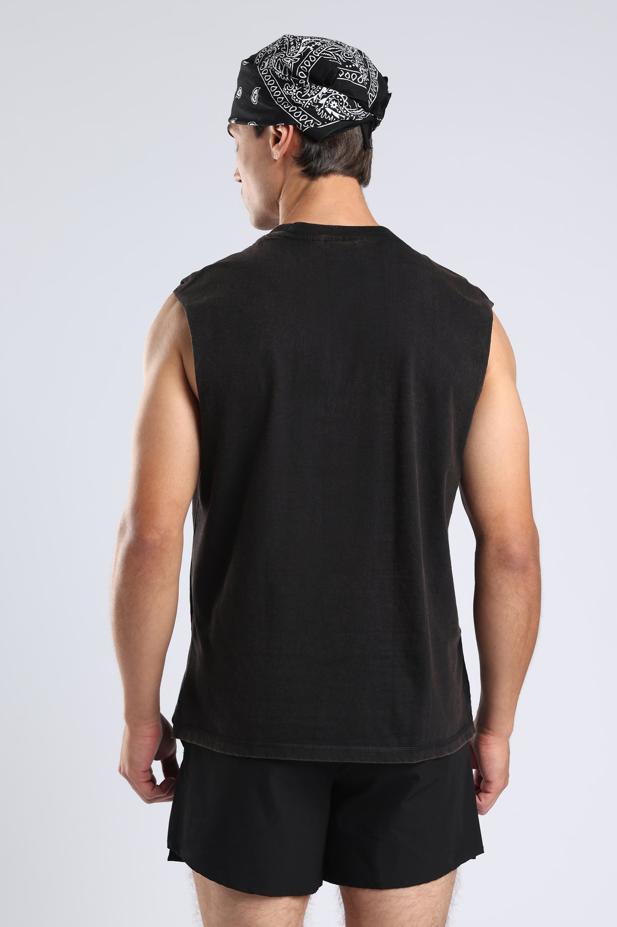 Back view of the Carbon Wash tank showing its relaxed oversized fit