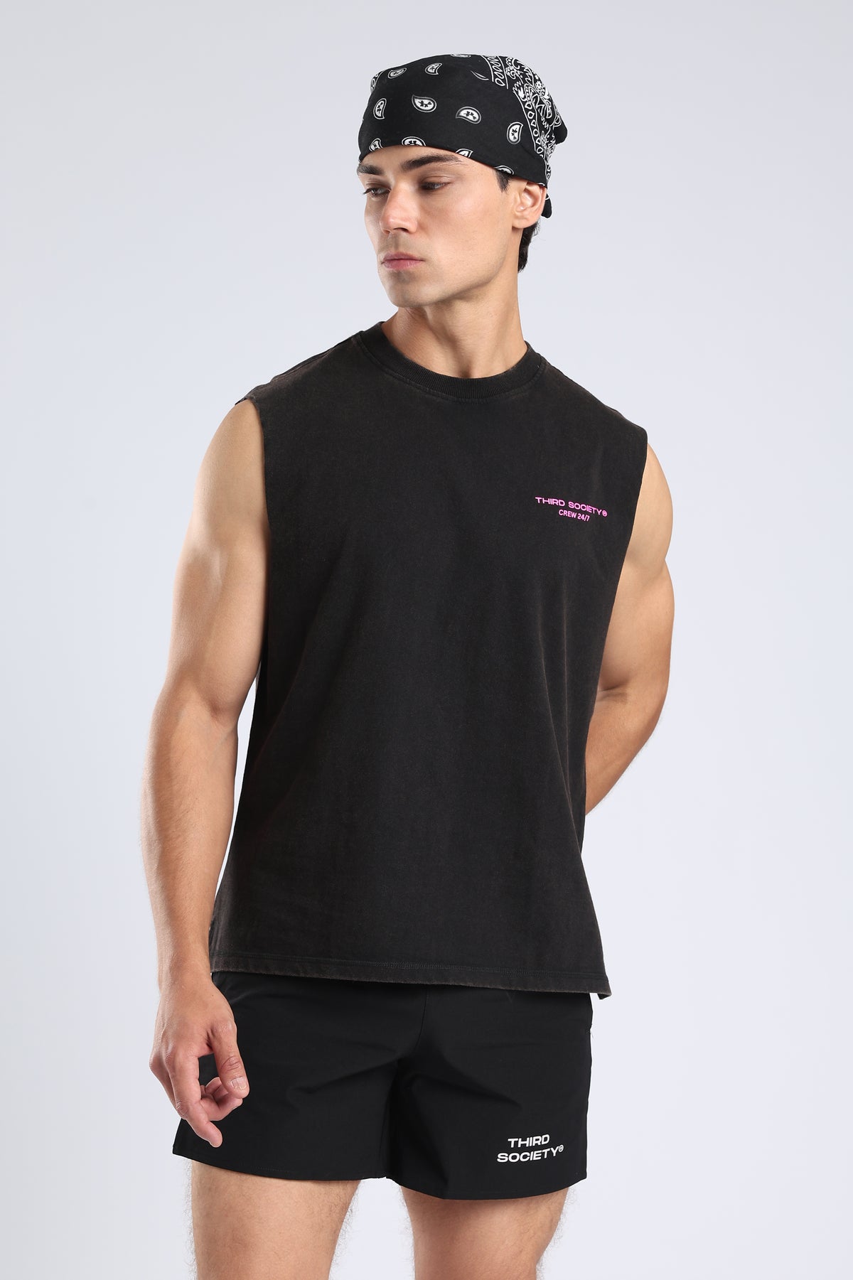 Model wearing the Carbon Wash tank with a black bandana