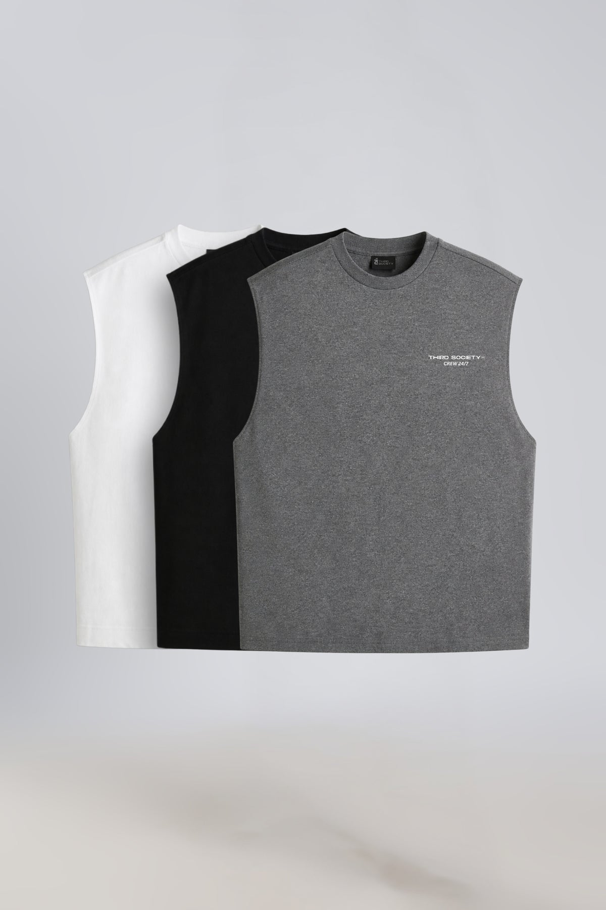 Three Third Society tank tops in Grey Marl, Black and White displayed together