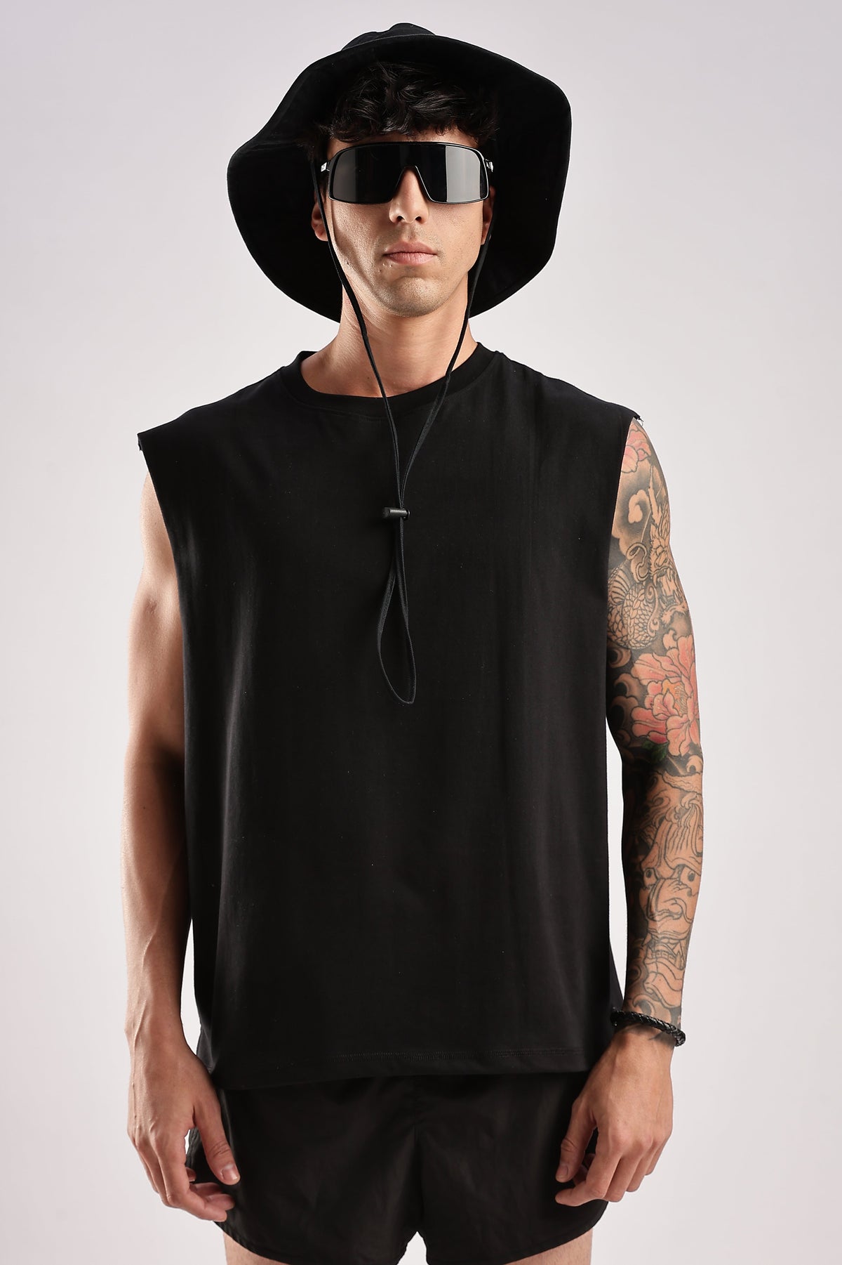 Black men's gym tank top, front view