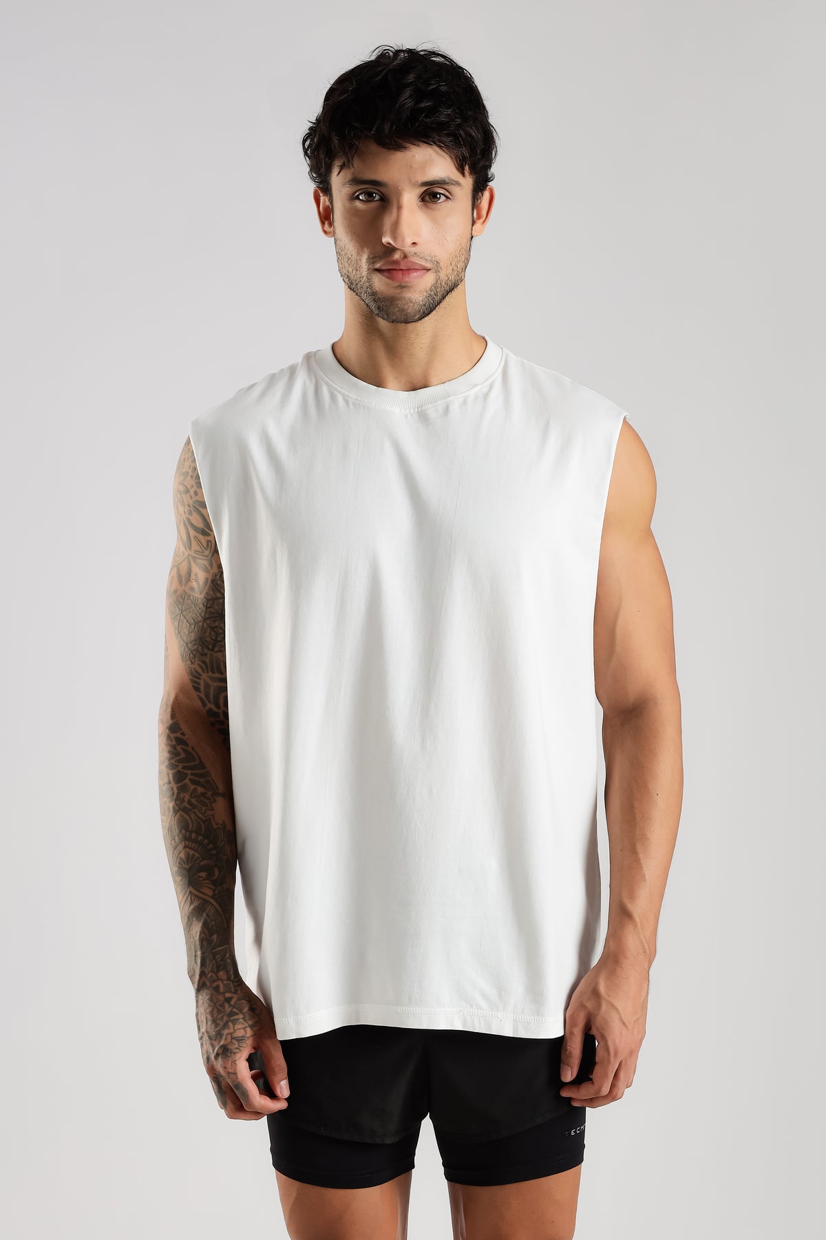 Close-up front view of the white Training Club tank showing the oversized fit