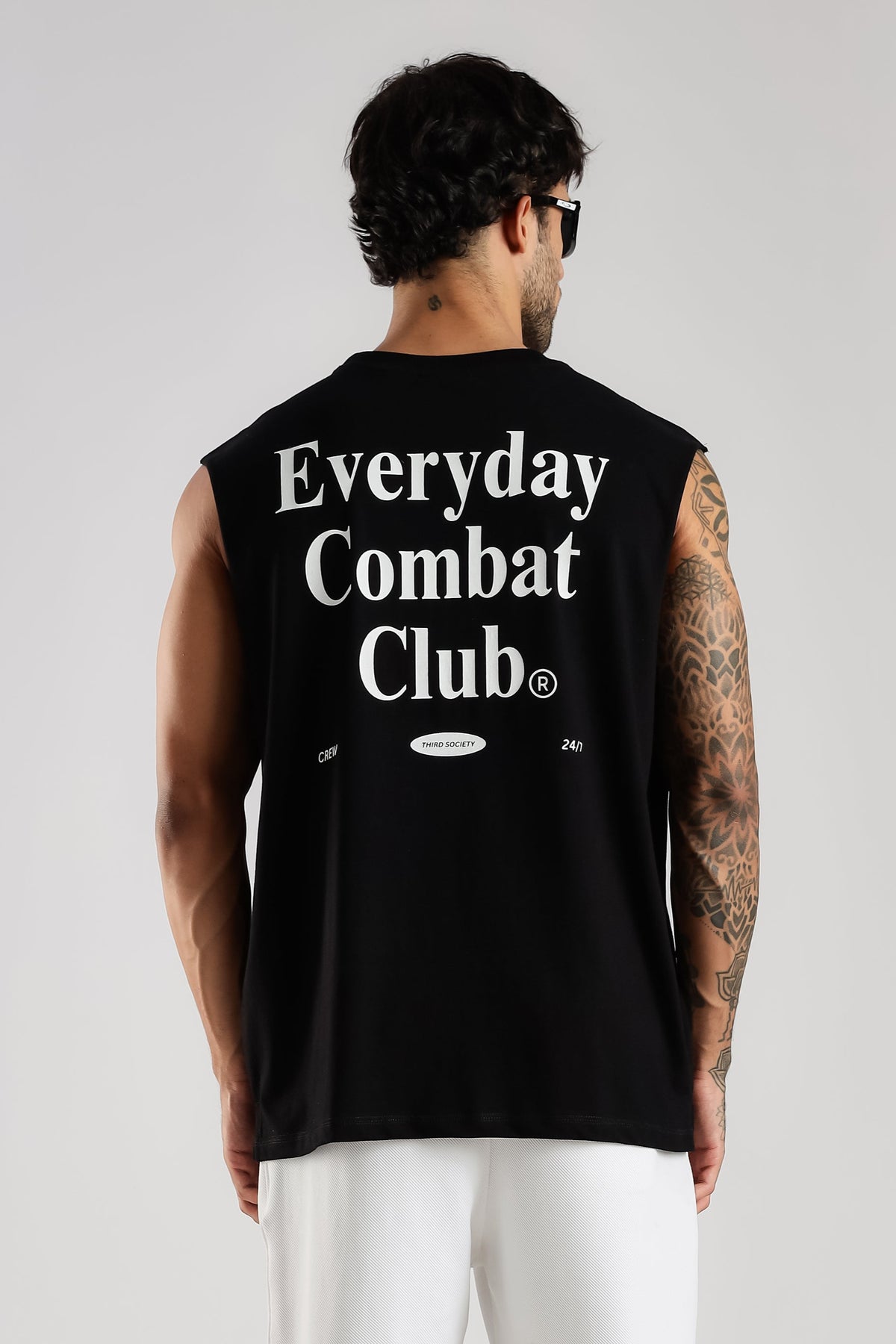 Model wearing the black Combat Club tank top from the back with the Everyday Combat Club graphic