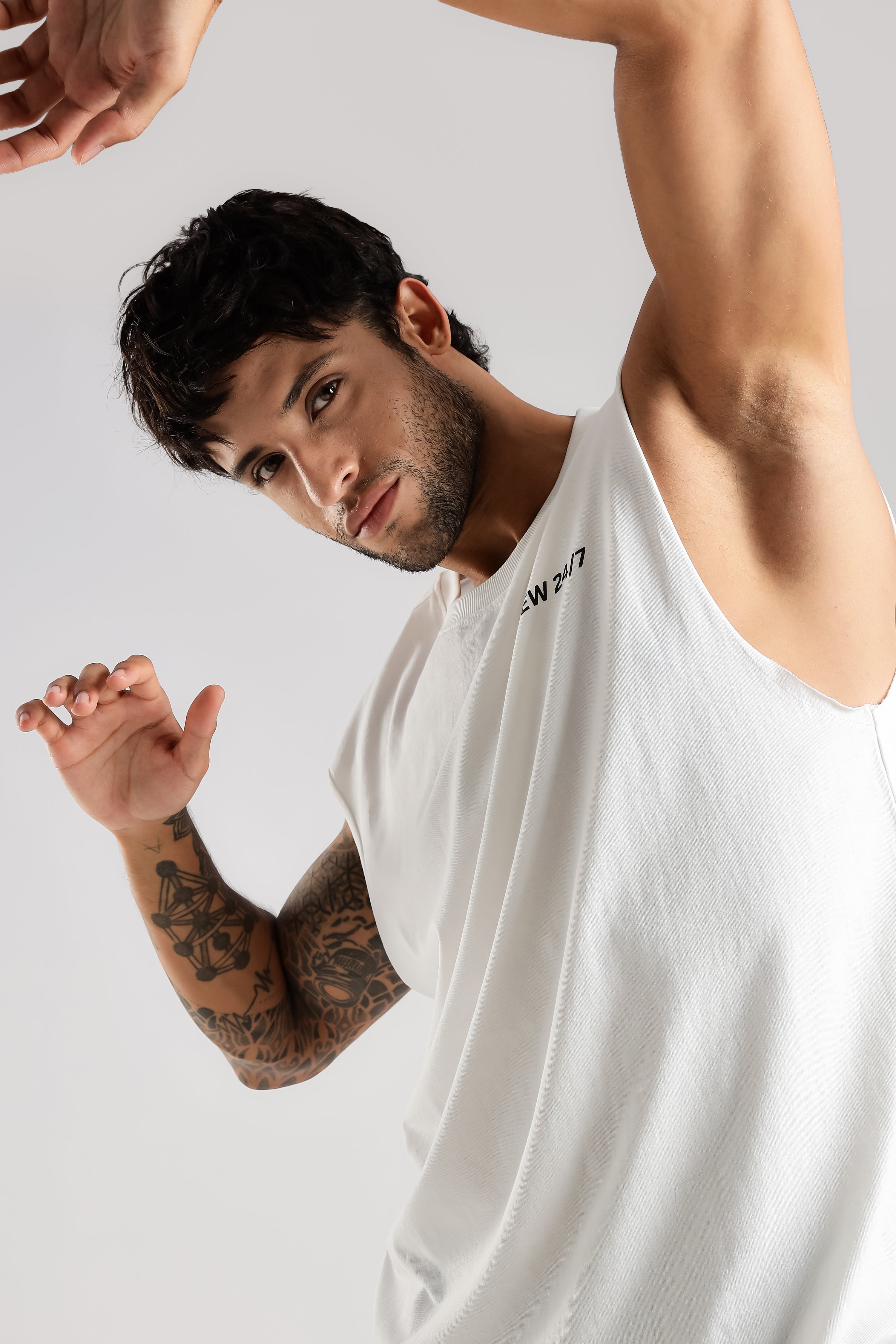 Close-up of the white Combat Club Tank showing its sleeveless cut and relaxed fit