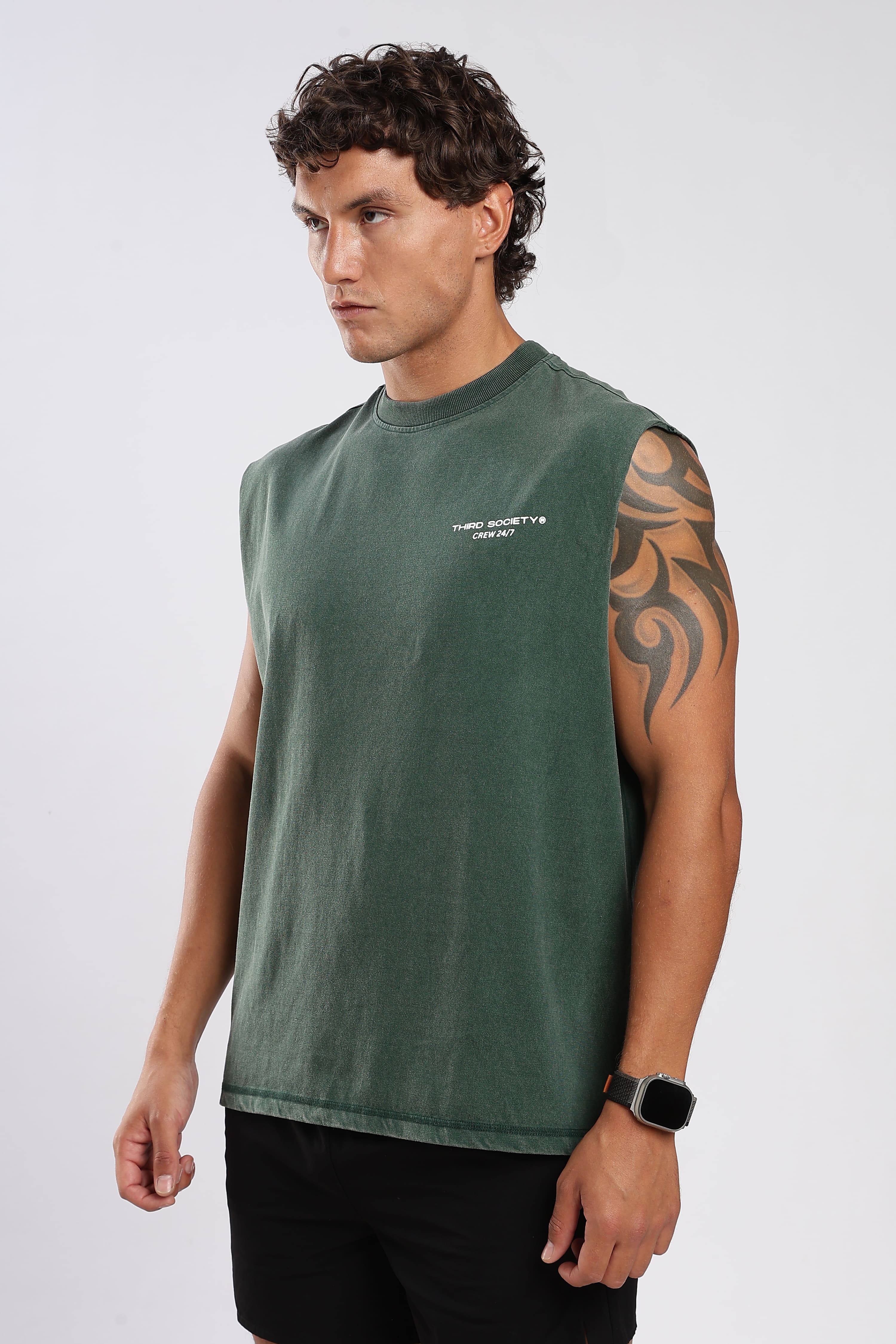 Forest Moss green tank top showing the relaxed oversized fit
