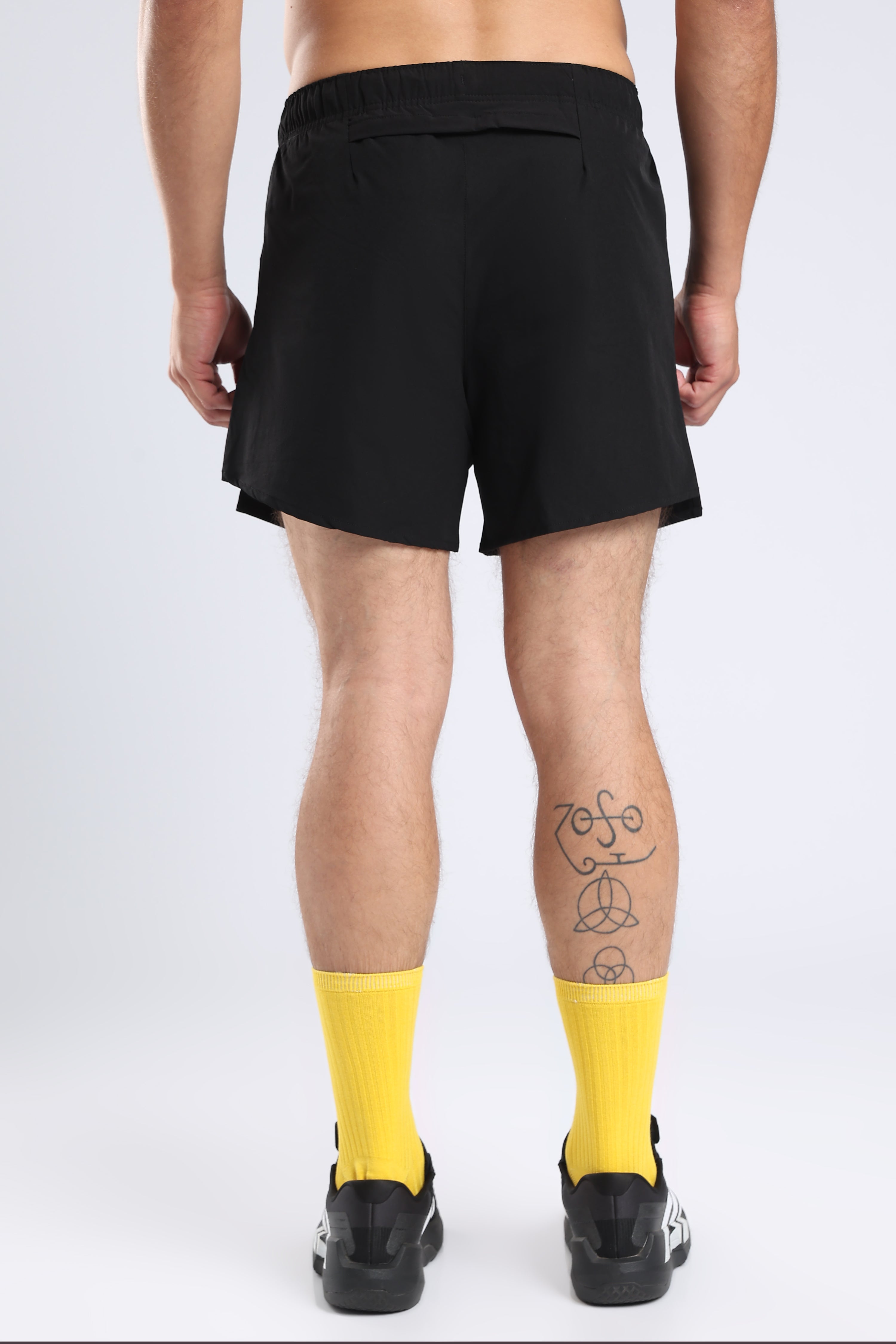 Rear view of black Hybrid 5-Inch Running Shorts showing the back pocket