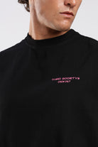 Close-up of the Third Society Crew 24/7 chest graphic on the black tank top