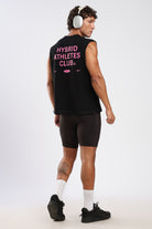 Model wearing the black and pink Hybrid Athletes tank top from the back