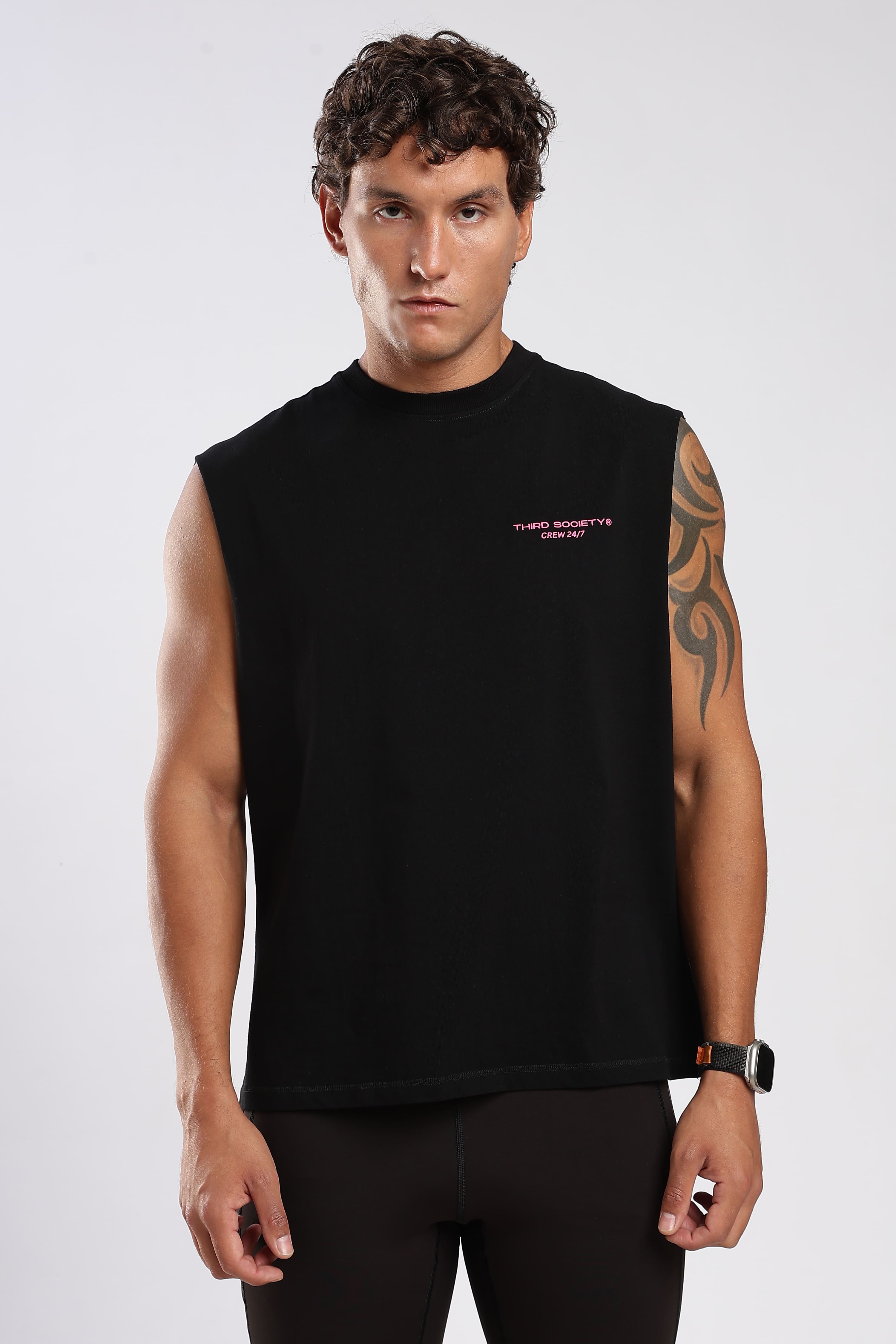 Front view of the black tank top showing the relaxed oversized fit
