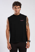 Front view of the black tank top showing the relaxed oversized fit