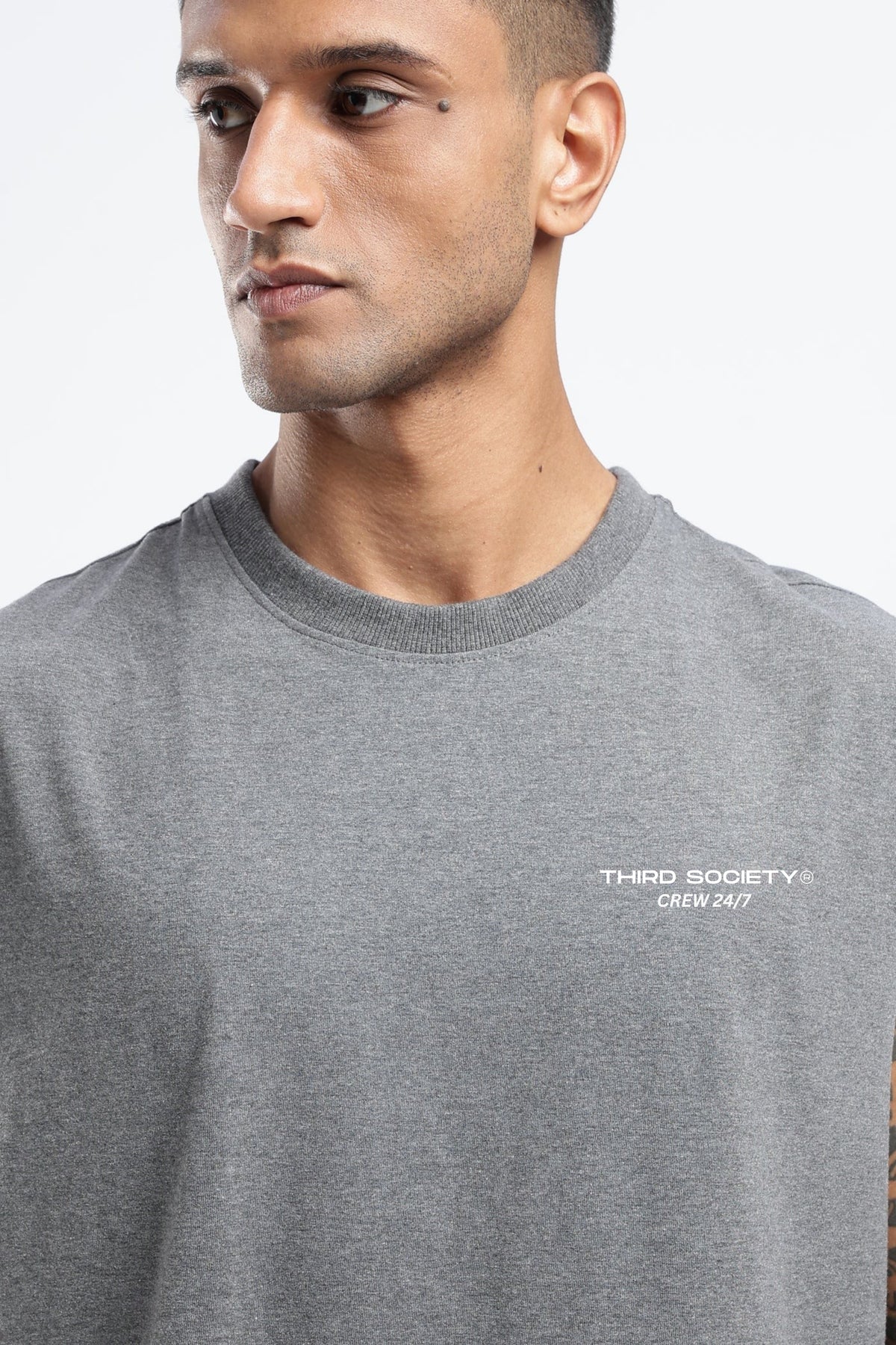 Close-up of the Grey Marl tank top showing the Third Society Crew 24/7 chest branding