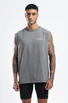 Model wearing the Grey Marl Hybrid Athletes tank top showing the oversized fit and chest logo