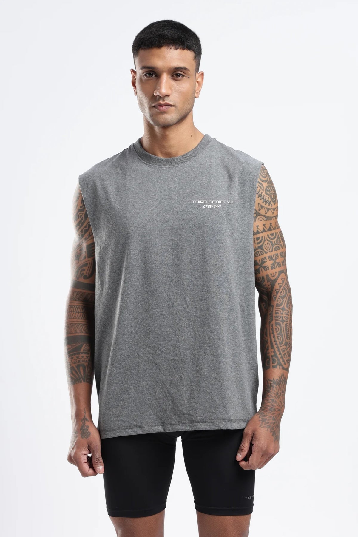Model wearing the Grey Marl Hybrid Athletes tank top showing the oversized fit and chest logo