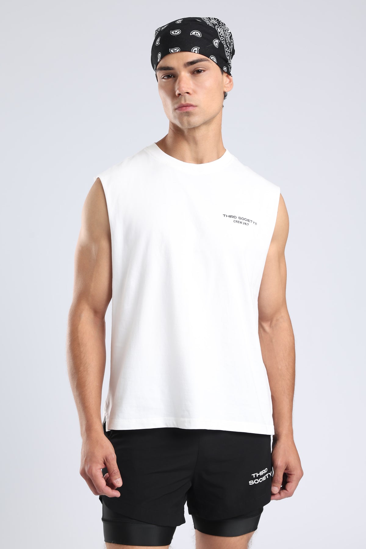 Front view of the White Hybrid Athletes tank showing its small chest logo