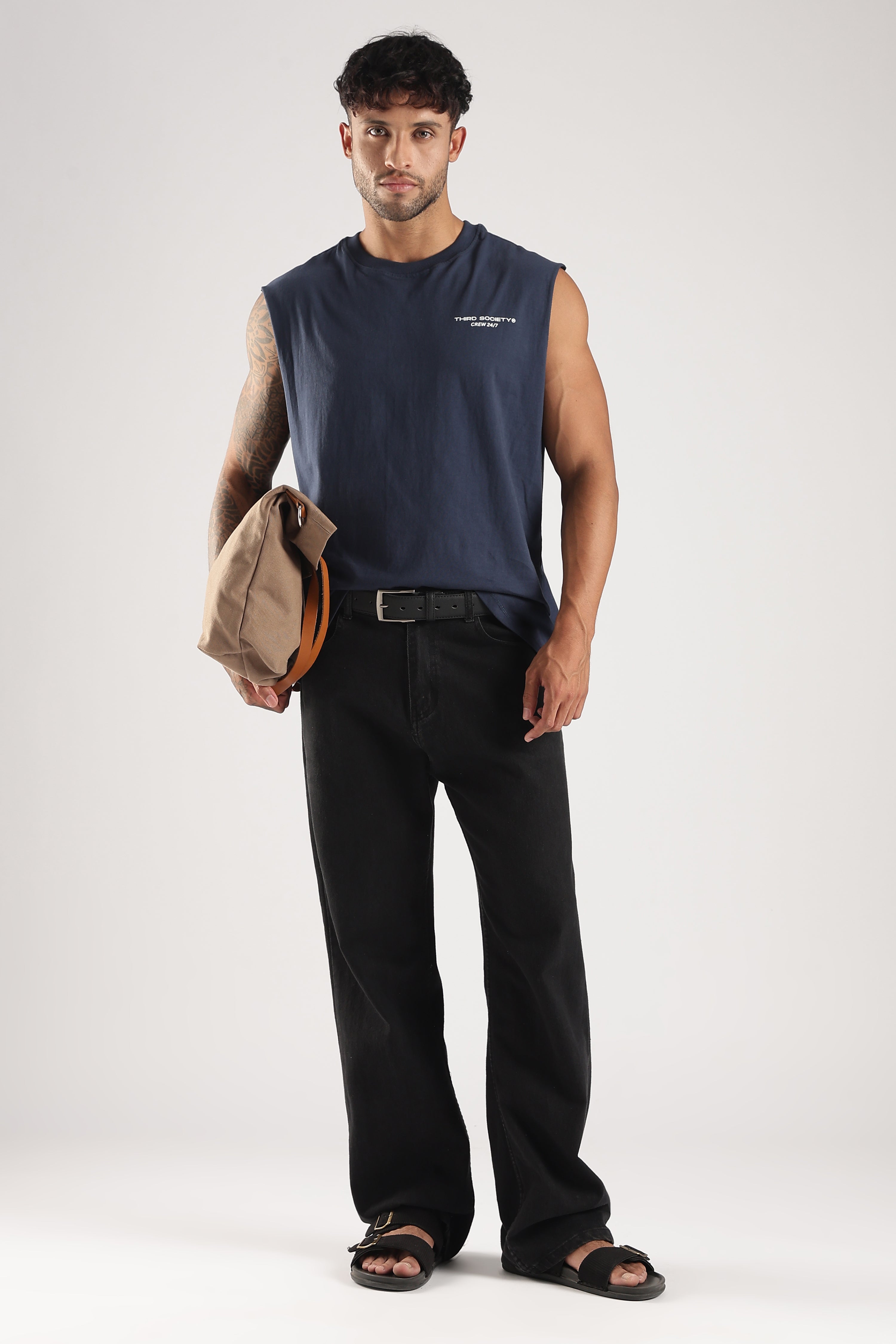 Iron Blue oversized tank styled with black trousers and a casual crossbody bag