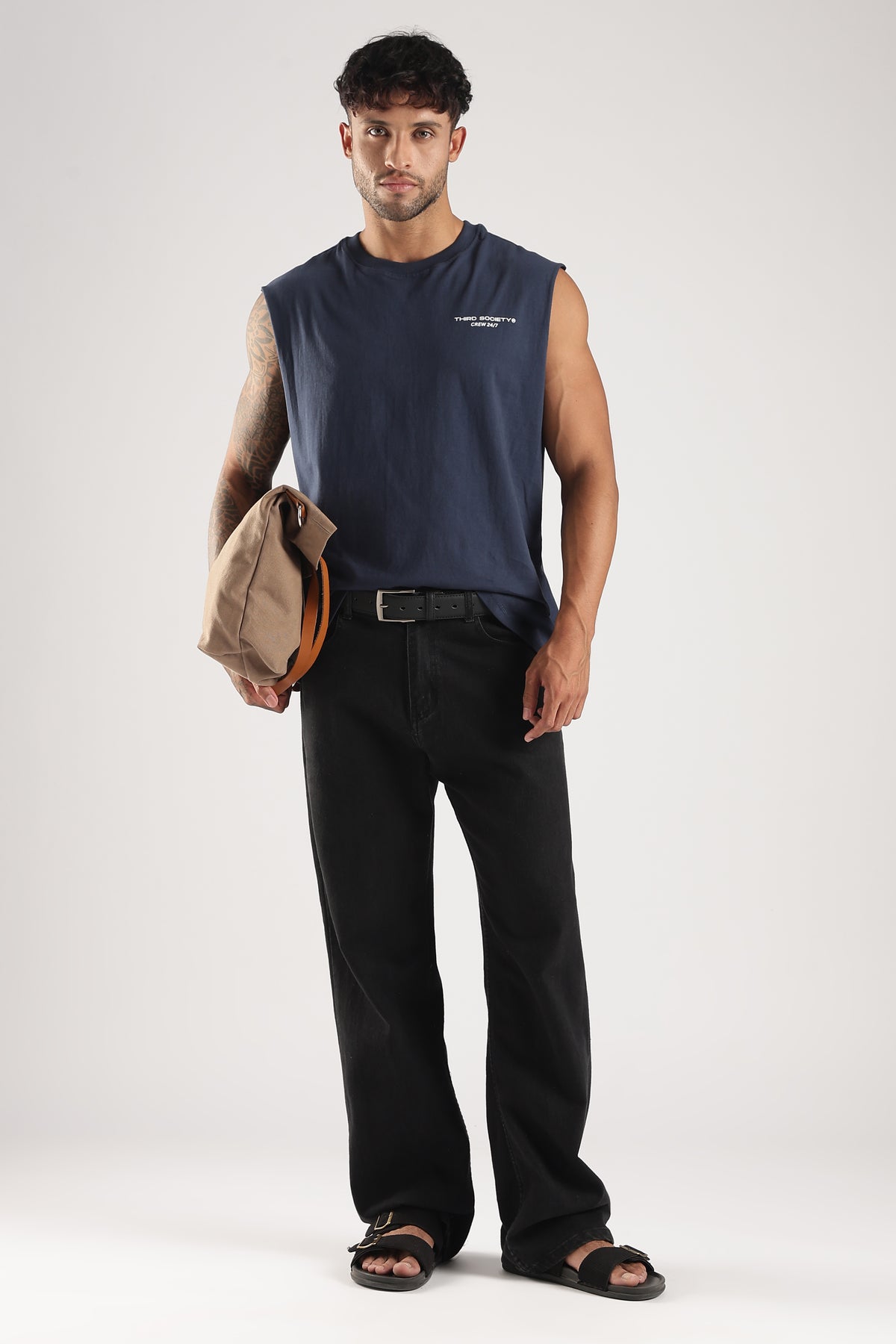 Iron Blue oversized tank styled with black trousers and a casual crossbody bag