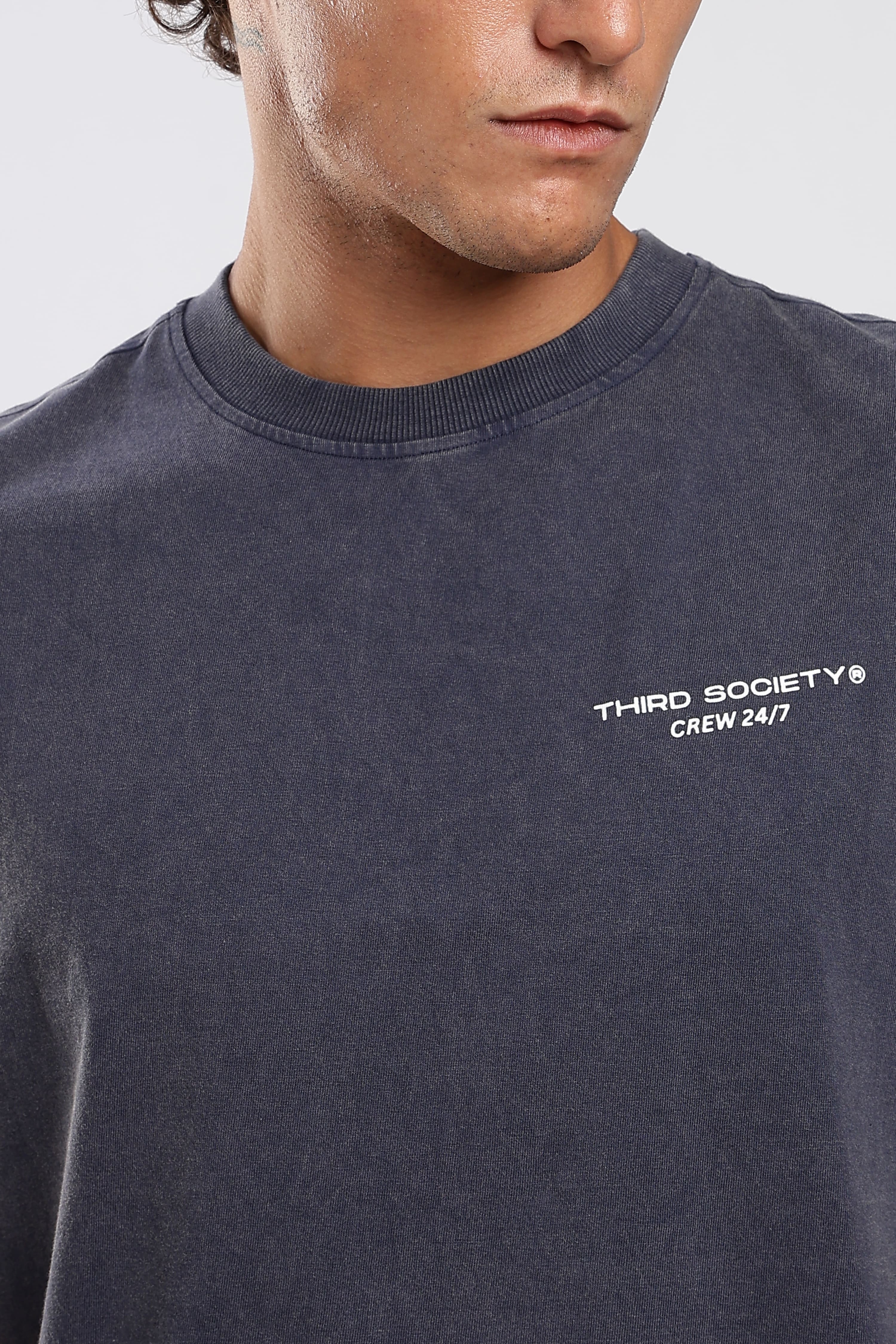 Close-up of Third Society logo on the Iron Slate tank top