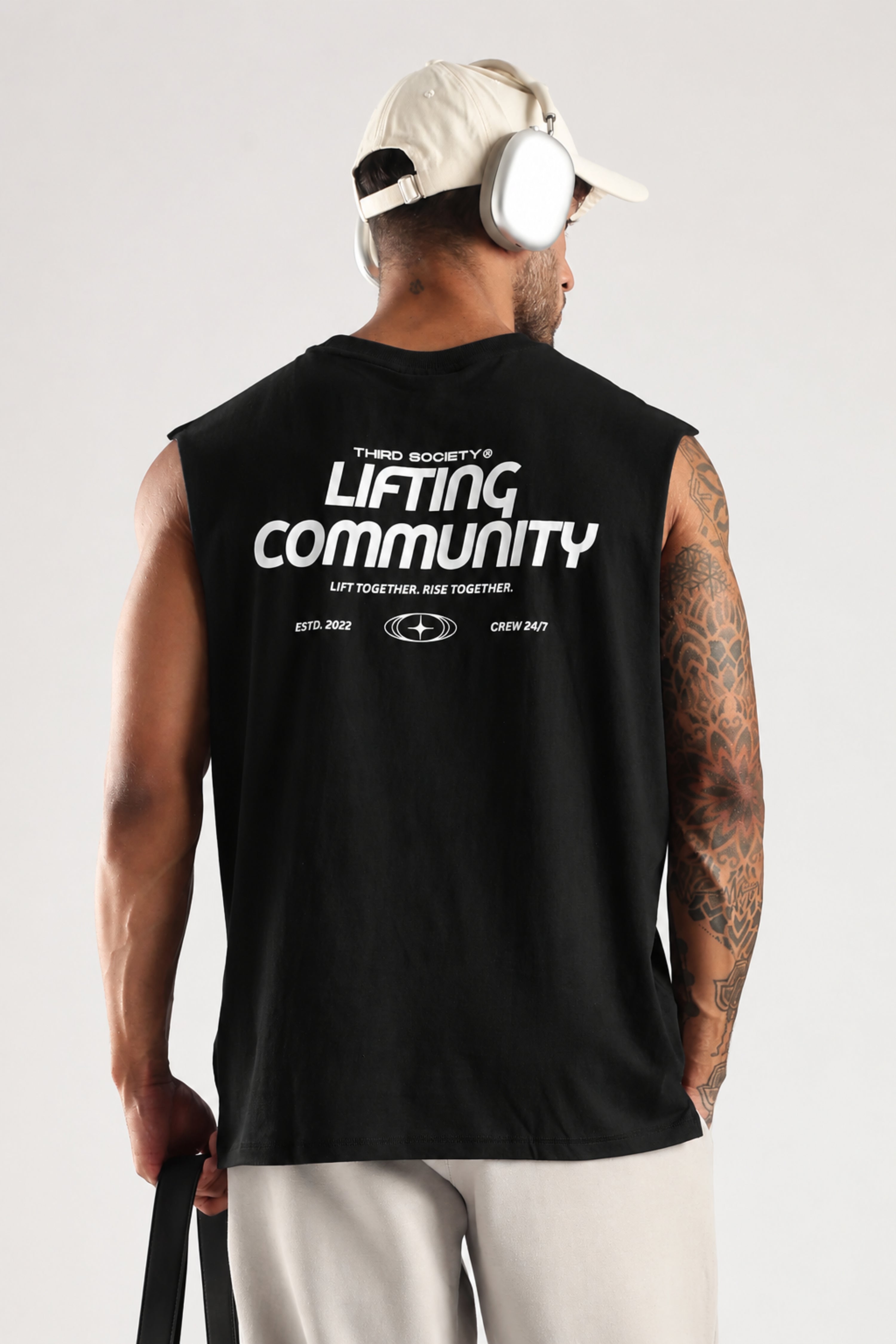 Model wearing the black Lifting Community tank top showing the back graphic