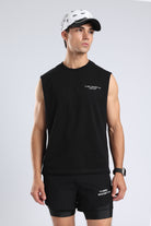 Model wearing the black Lifting Community tank with small chest branding
