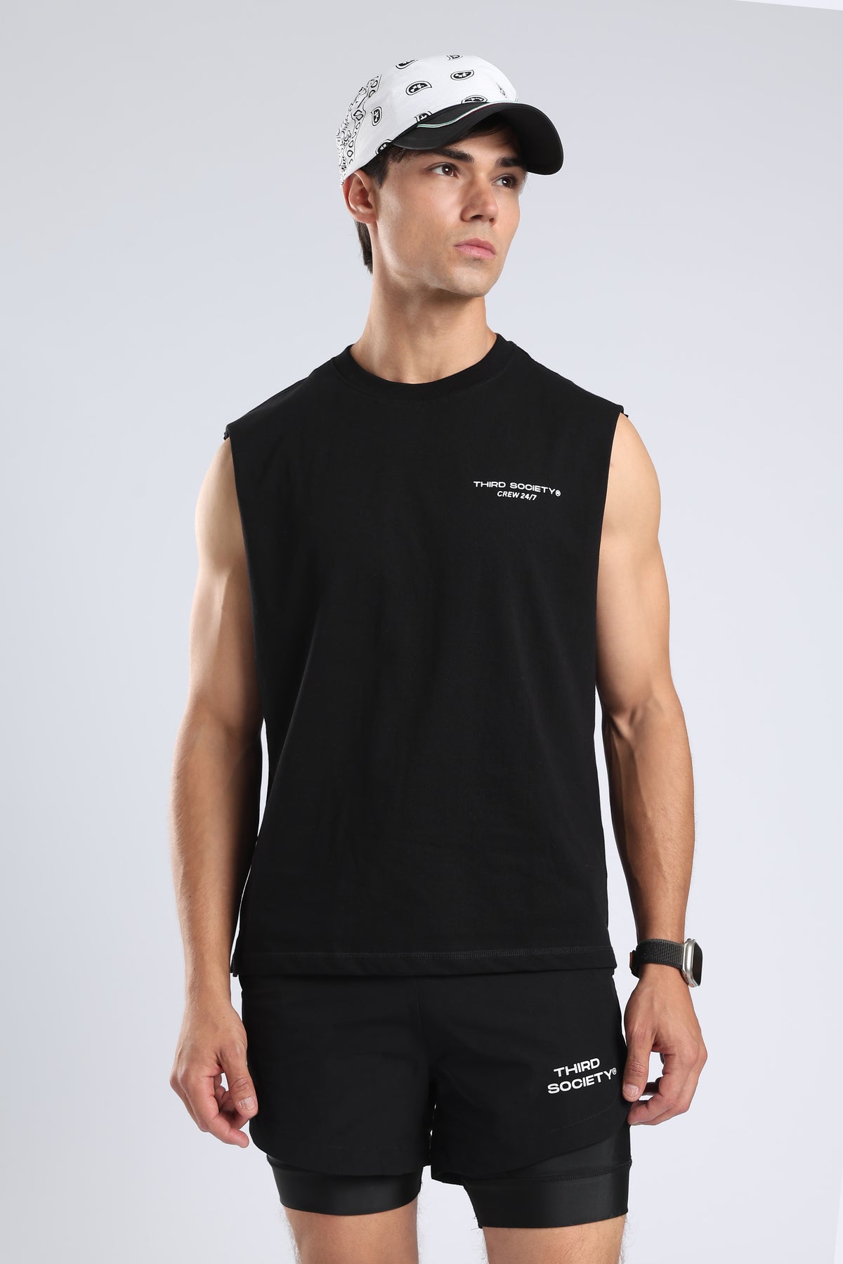 Model wearing the black Lifting Community tank with small chest branding