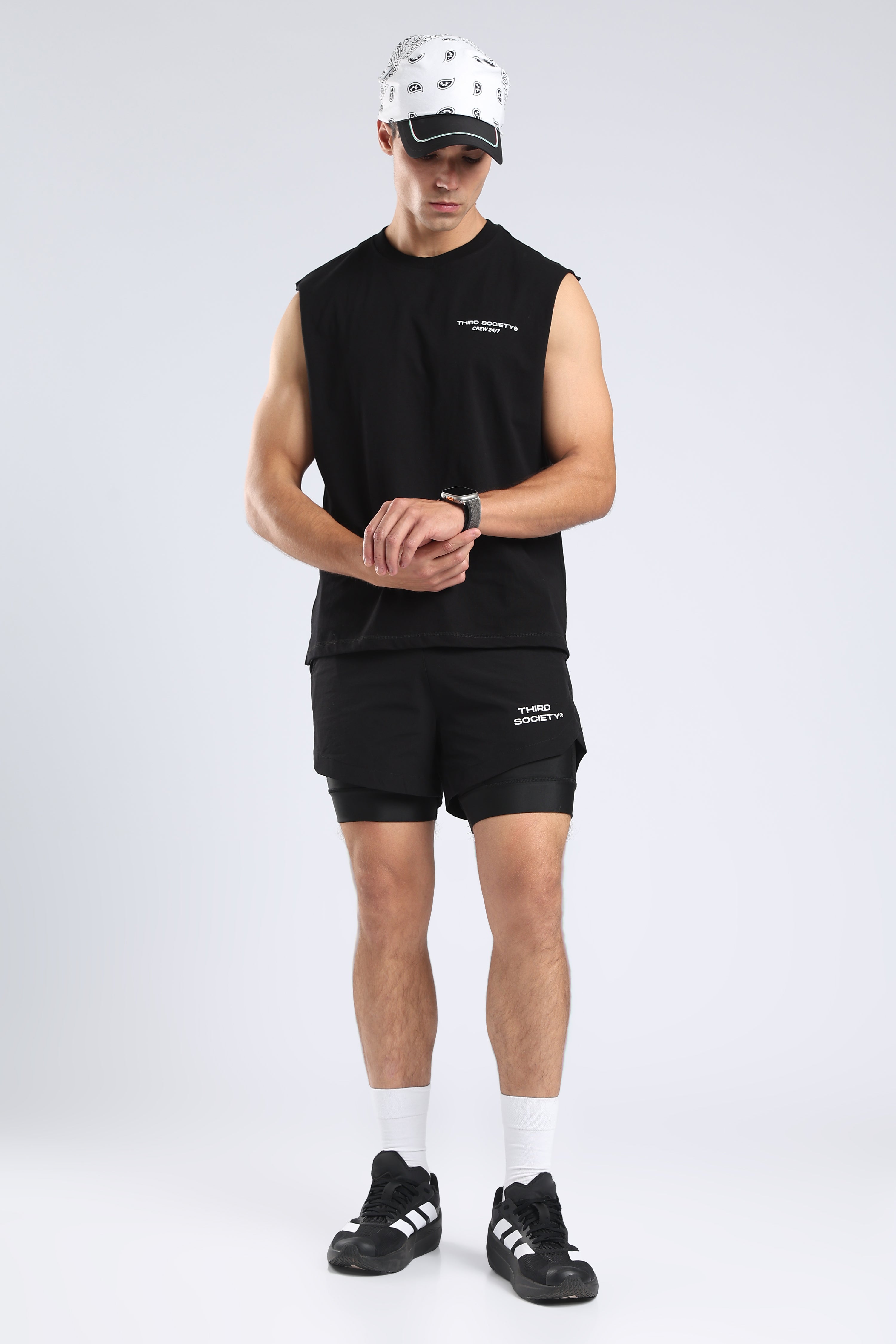 Model wearing the black Lifting Community tank with black training shorts