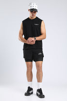 Model wearing the black Lifting Community tank with black training shorts