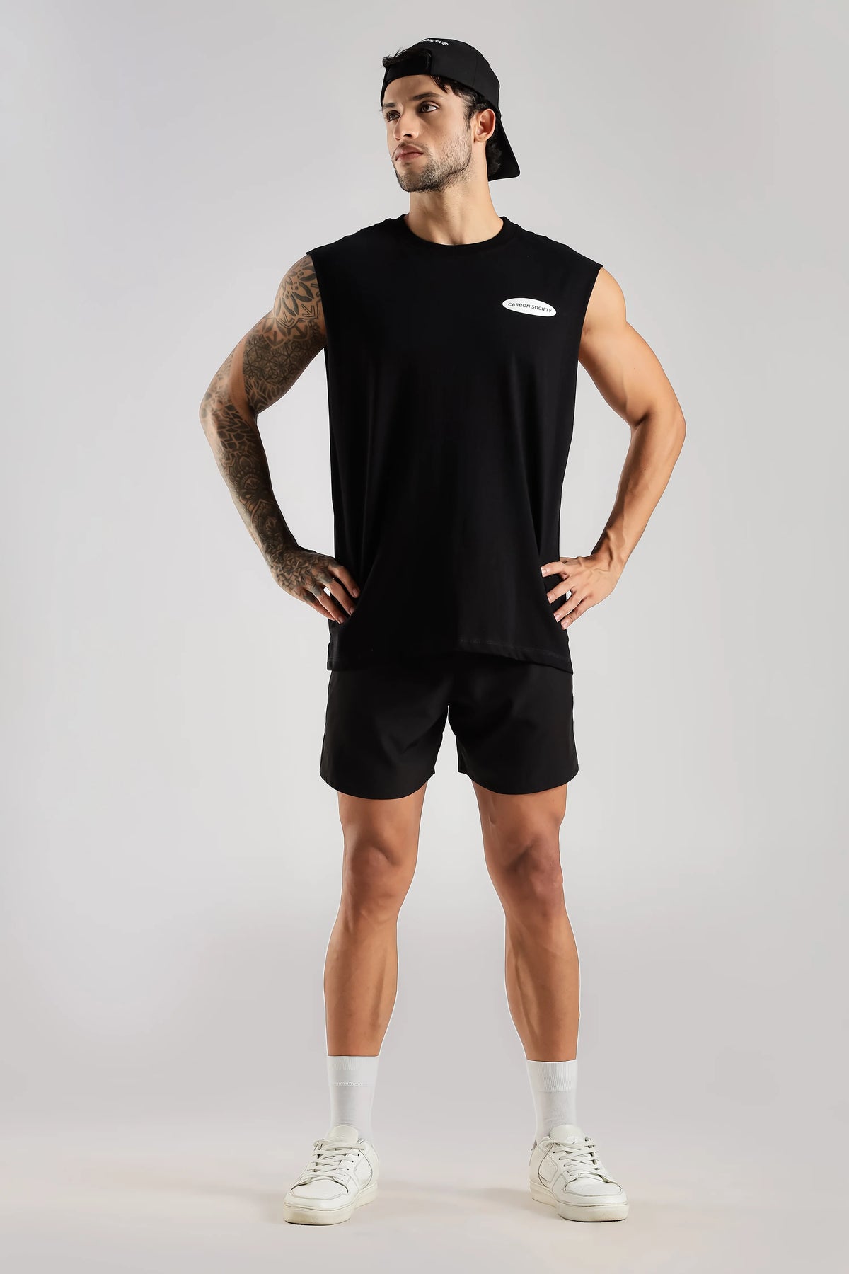 Black men's tank top with Carbon Society chest logo