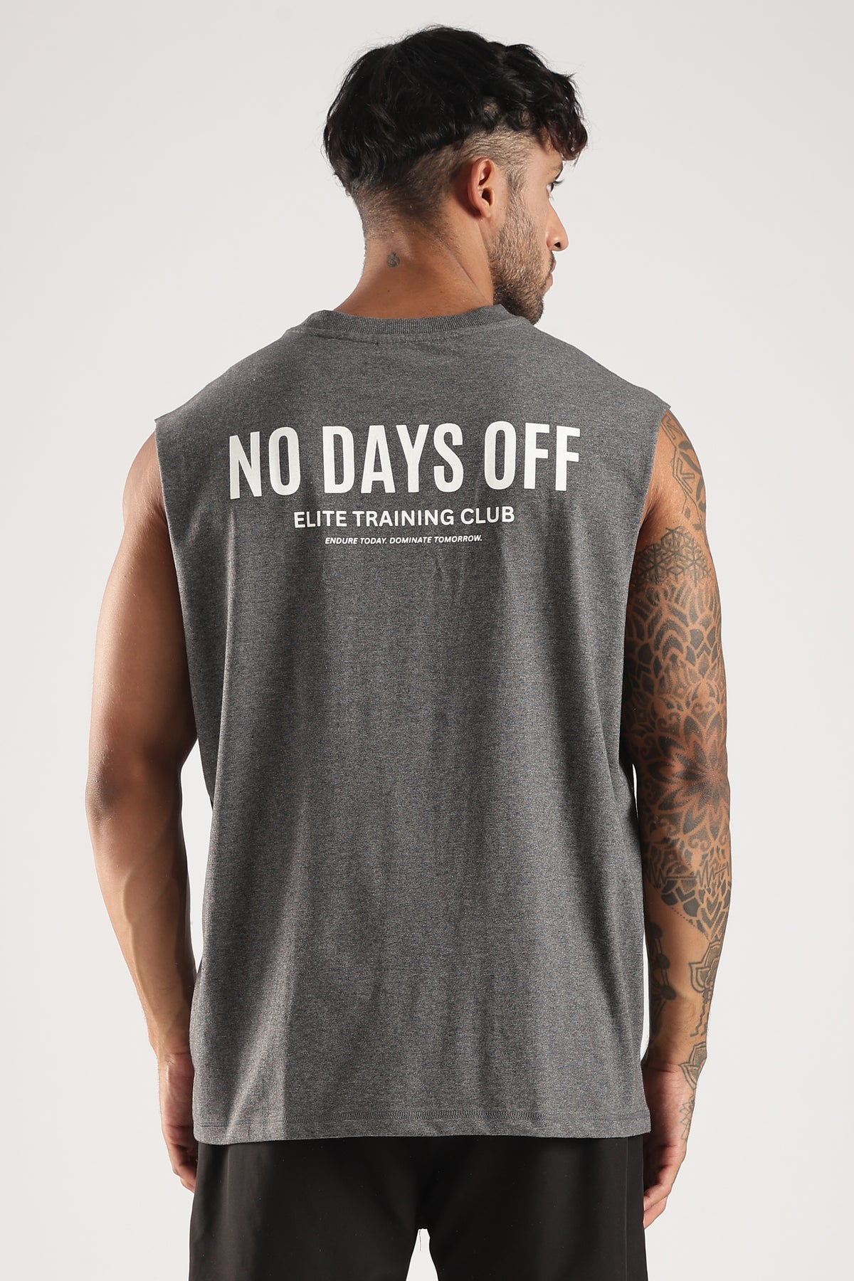 Close-up of the white No Days Off Elite Training Club graphic on the tank