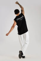 Black oversized tank top showing the relaxed fit during movement