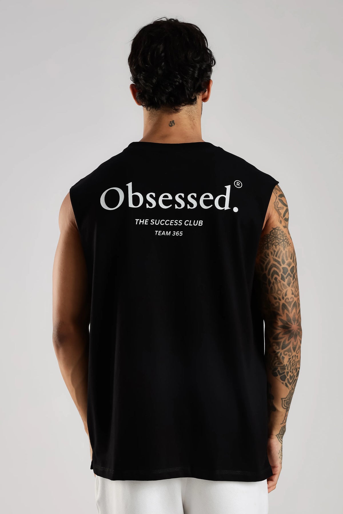 Back view of black tank top with Obsessed Success Club graphic