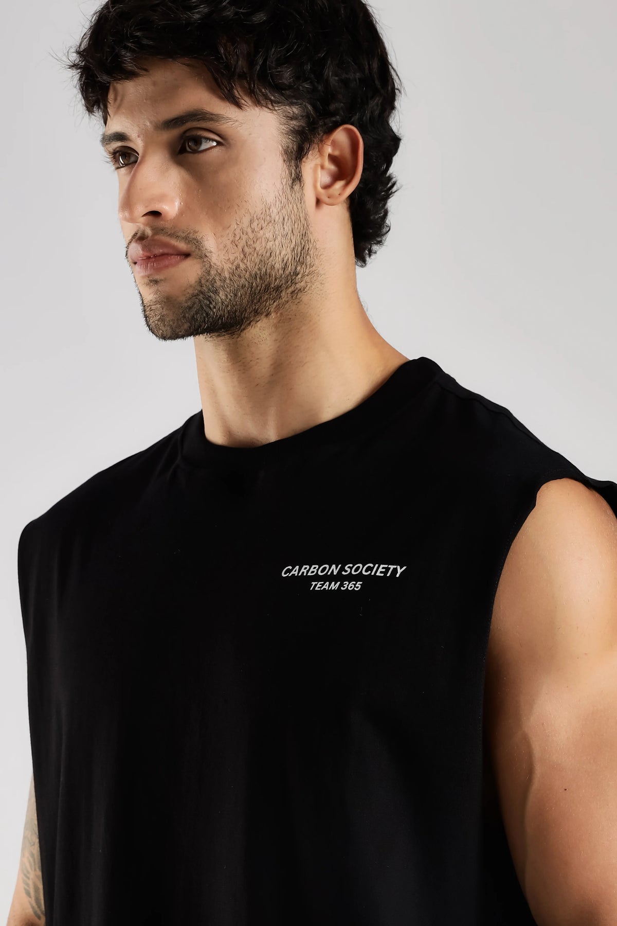 Black men's tank top with Carbon Society chest graphic