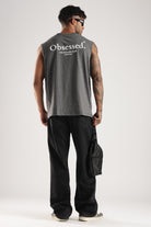 Model wearing the Grey Marl Obsessed Tank from the back with the Success Club graphic and crossbody bag