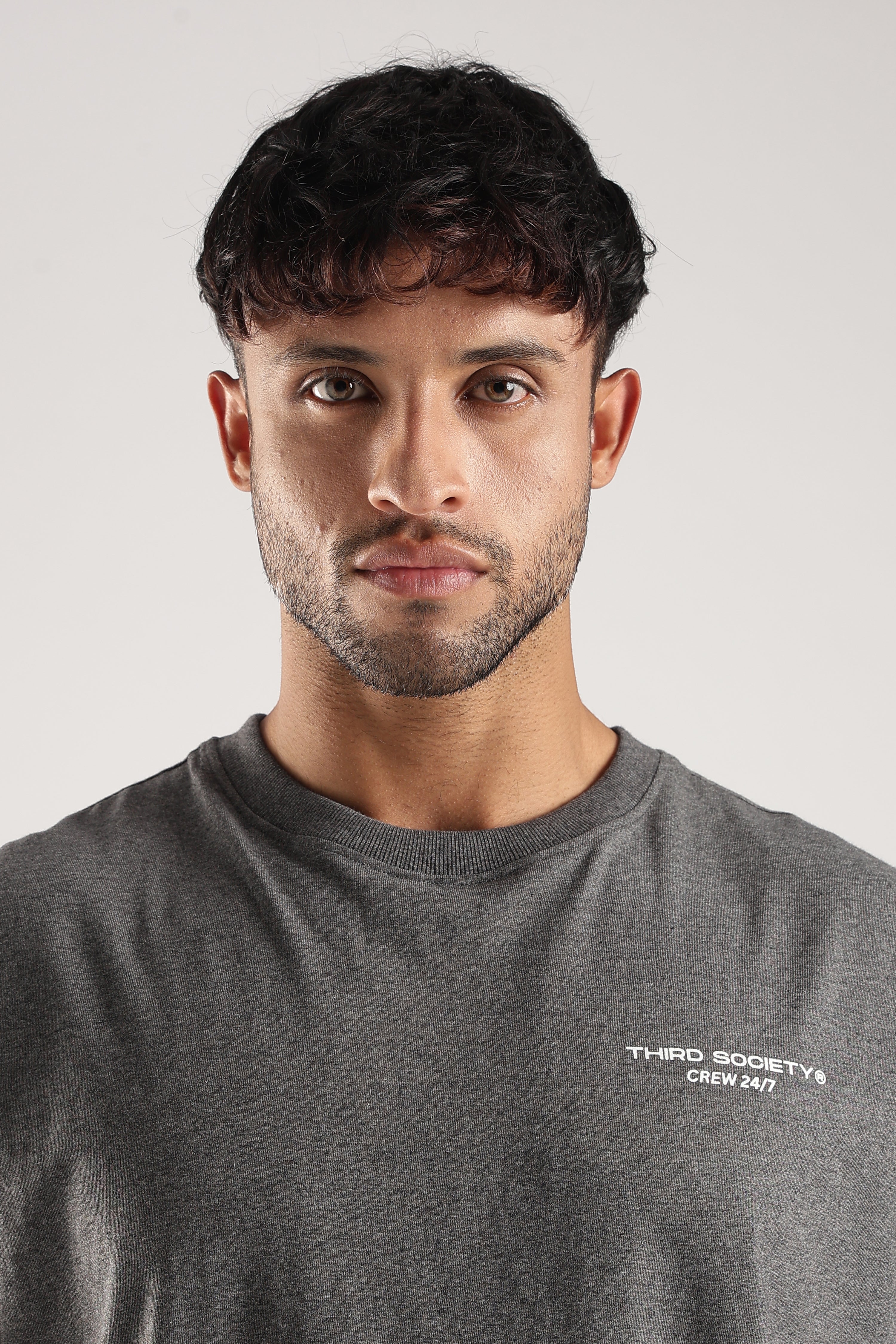 Close-up of the Grey Marl Obsessed Tank showing the Third Society Crew 24/7 chest logo