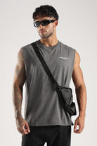 Model wearing the Grey Marl Obsessed Tank with sunglasses, black trousers and a crossbody bag