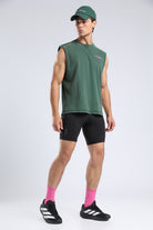 Model wearing the Forest Moss Runners Without Permission tank with black compression shorts