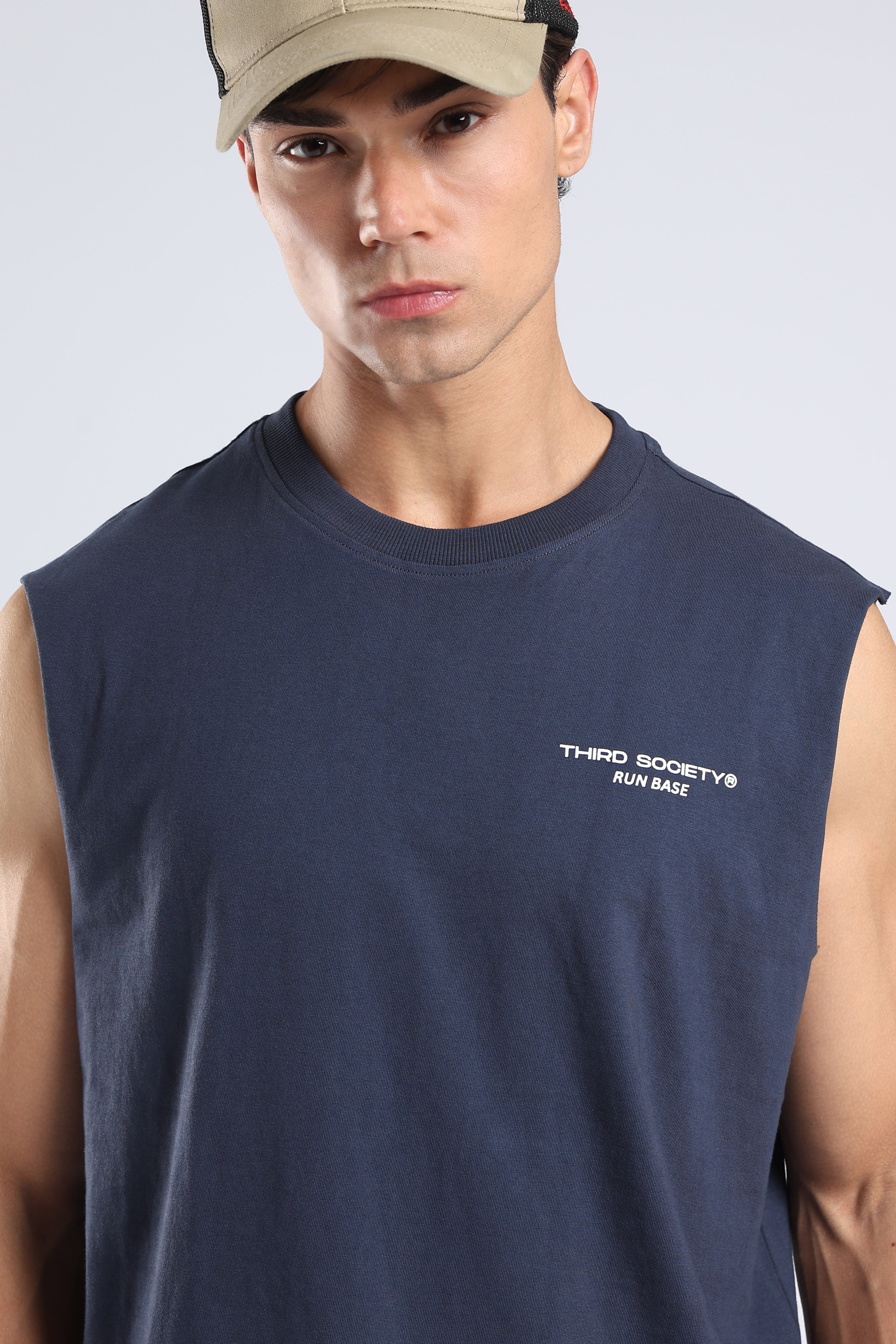 Model wearing the Iron Blue sleeveless tank with a relaxed fit