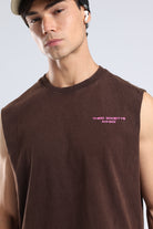 Model wearing the Brown oversized tank with a chest logo and casual athletic styling