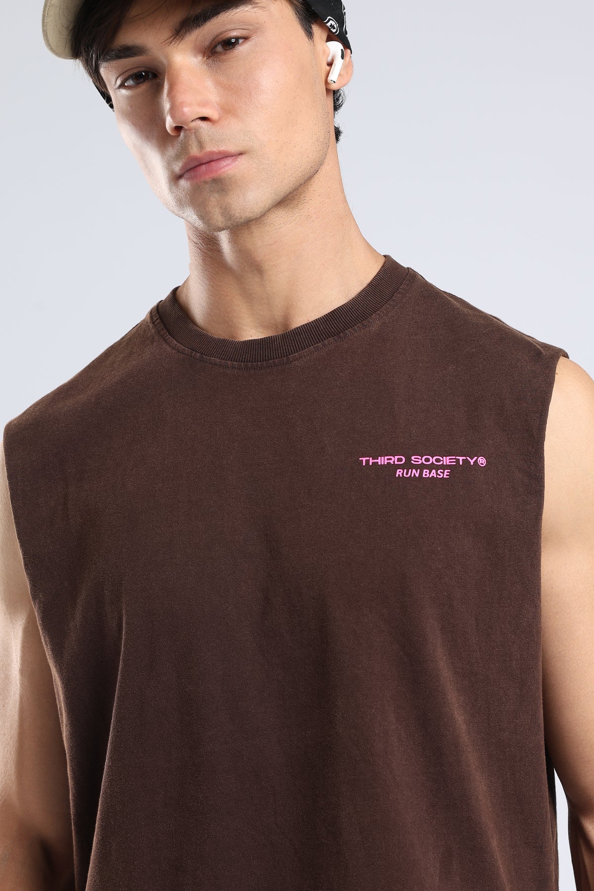 Model wearing the Brown oversized tank with a chest logo and casual athletic styling