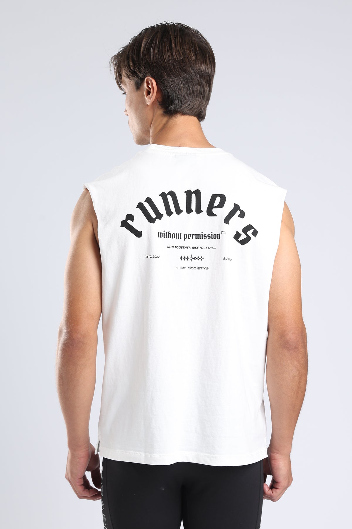 Close-up of the Runners Without Permission graphic on the white tank