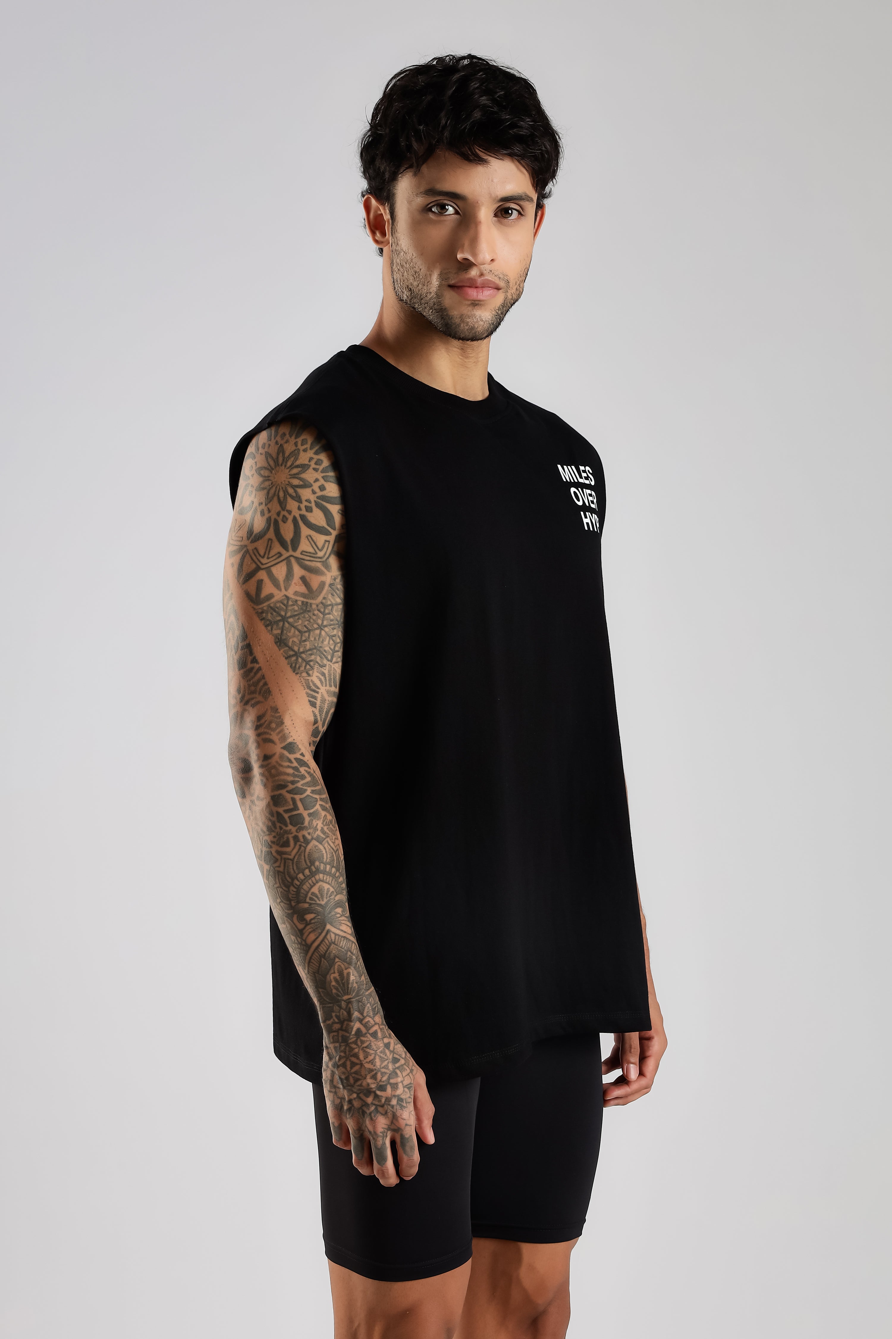 Side view of black men's running tank top showing the sleeveless fit