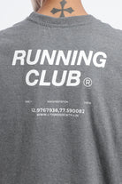 Close-up of the Running Club graphic printed on the back of the Grey Marl tank top